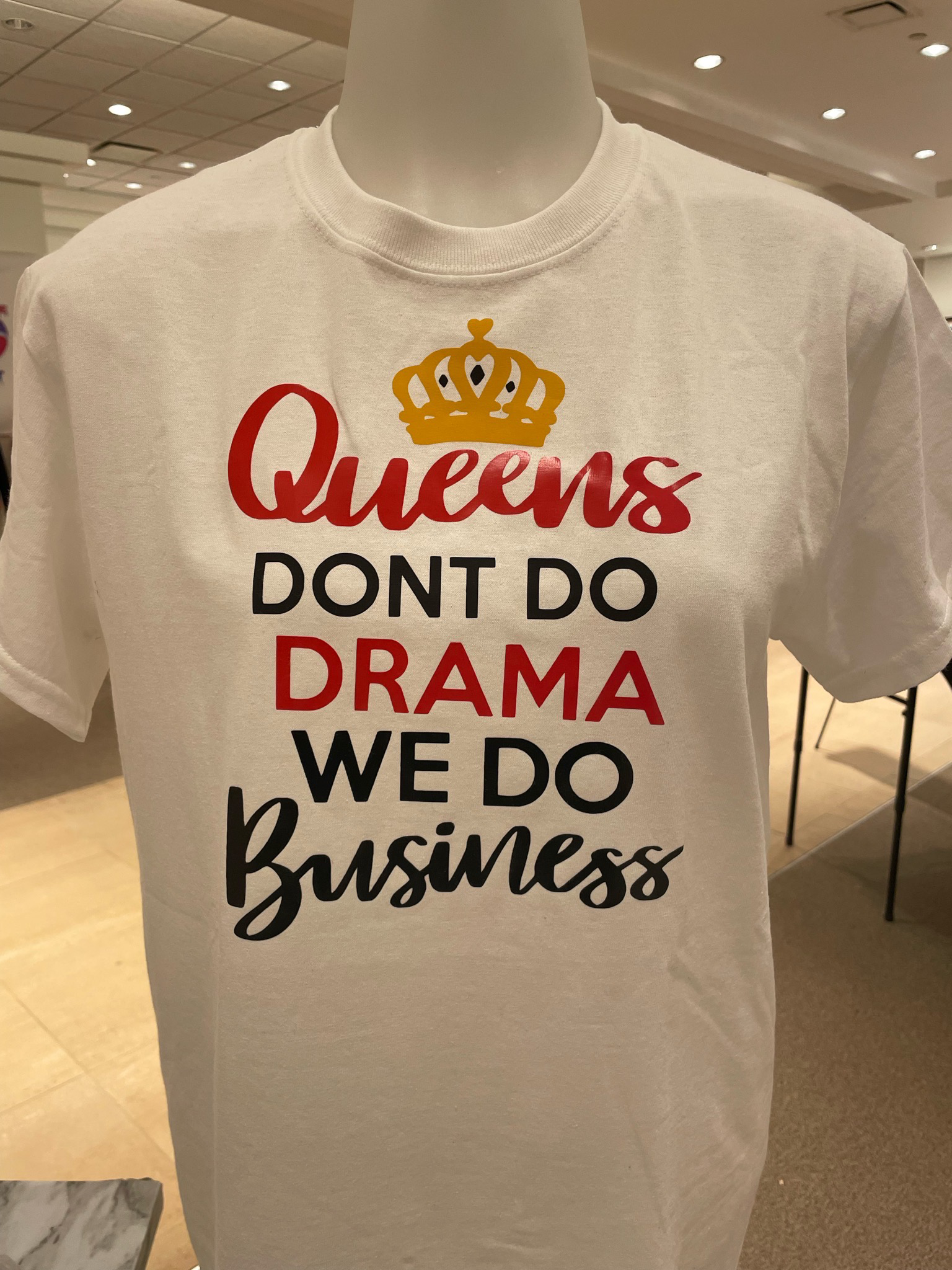 A T-Shirt that says ""Queens Don't Do Drama, We Do Business" on it